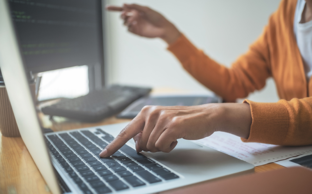 A woman on her laptop Exploring the Impact of WWDC 2023 Updates on App Store Optimization