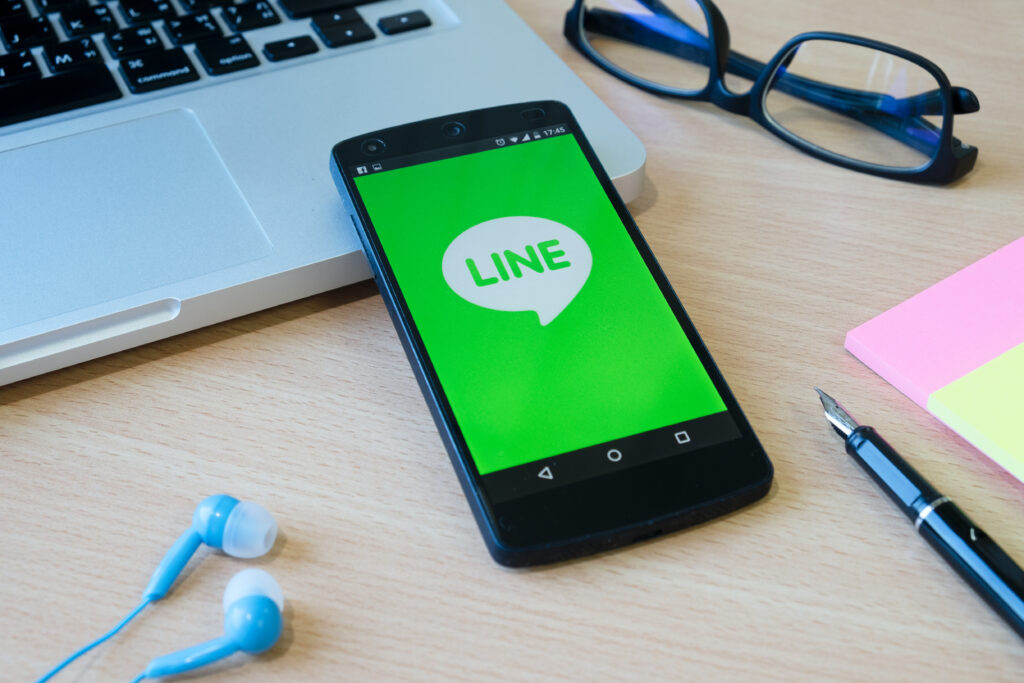 A phone opening LINE app to show marketing strategies and opportunities on LINE Japan